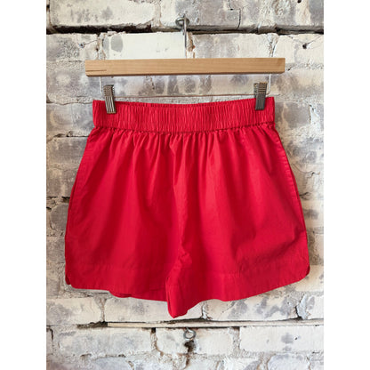Women's Chiara Shorts in True Red by LMND, showcasing the vibrant color and stylish fit of the casual summer shorts.