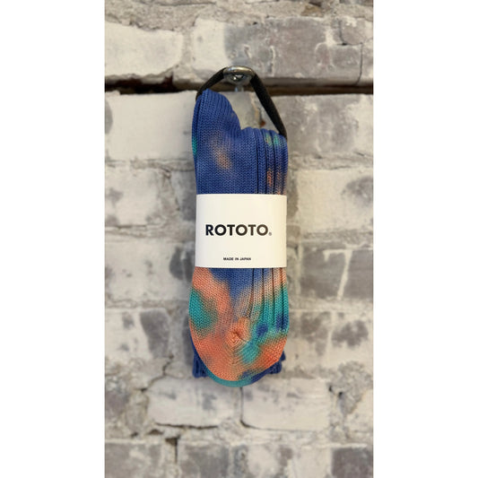 Men's chunky tie-dye rib crew socks by Rototo in vibrant blue and orange, with bold, textured knit pattern.
