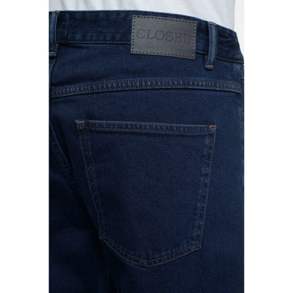 Men's Cooper True Comfort Stretch Jeans in dark blue by Closed Men's, showing the fit and fabric texture.