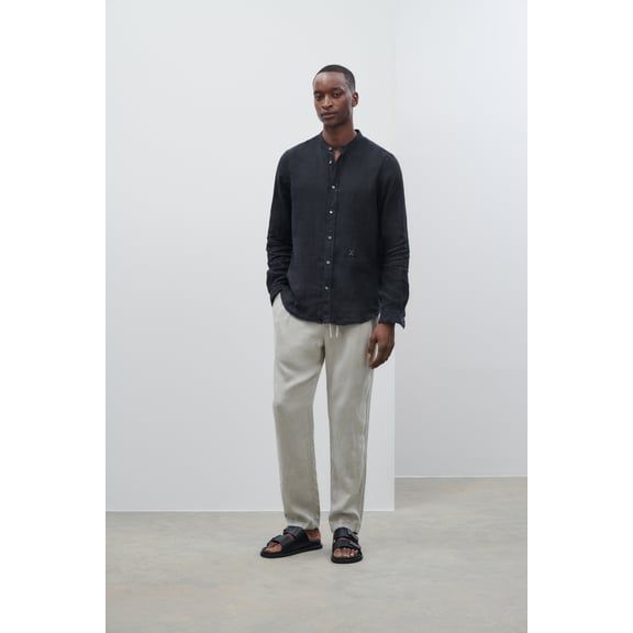 Men's Vigo Tapered Regular Pant in Cloud Grey by Closed Men's, showing the relaxed fit and fabric texture.