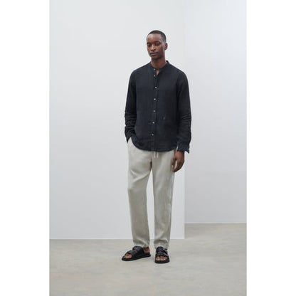 Men's Vigo Tapered Regular Pant in Cloud Grey by Closed Men's, showing the relaxed fit and fabric texture.