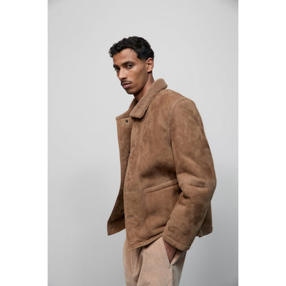 Men's chestnut lambskin jacket by Closed Men's, shown in natural light with a focus on the soft leather texture and stylish fit.