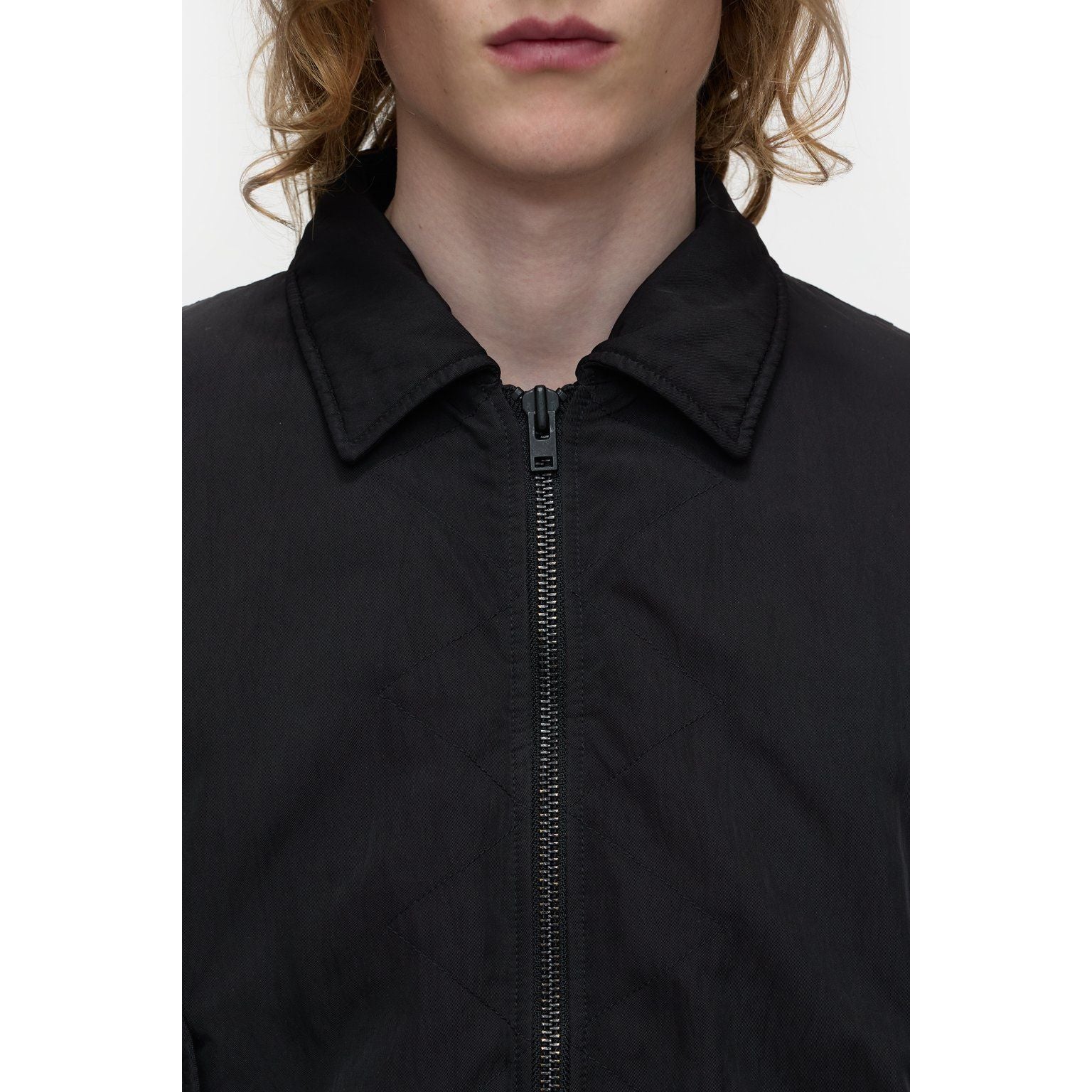 Men's nylon flight jacket in ebony by Closed Men's, featuring a sleek design and durable material for versatile wear.