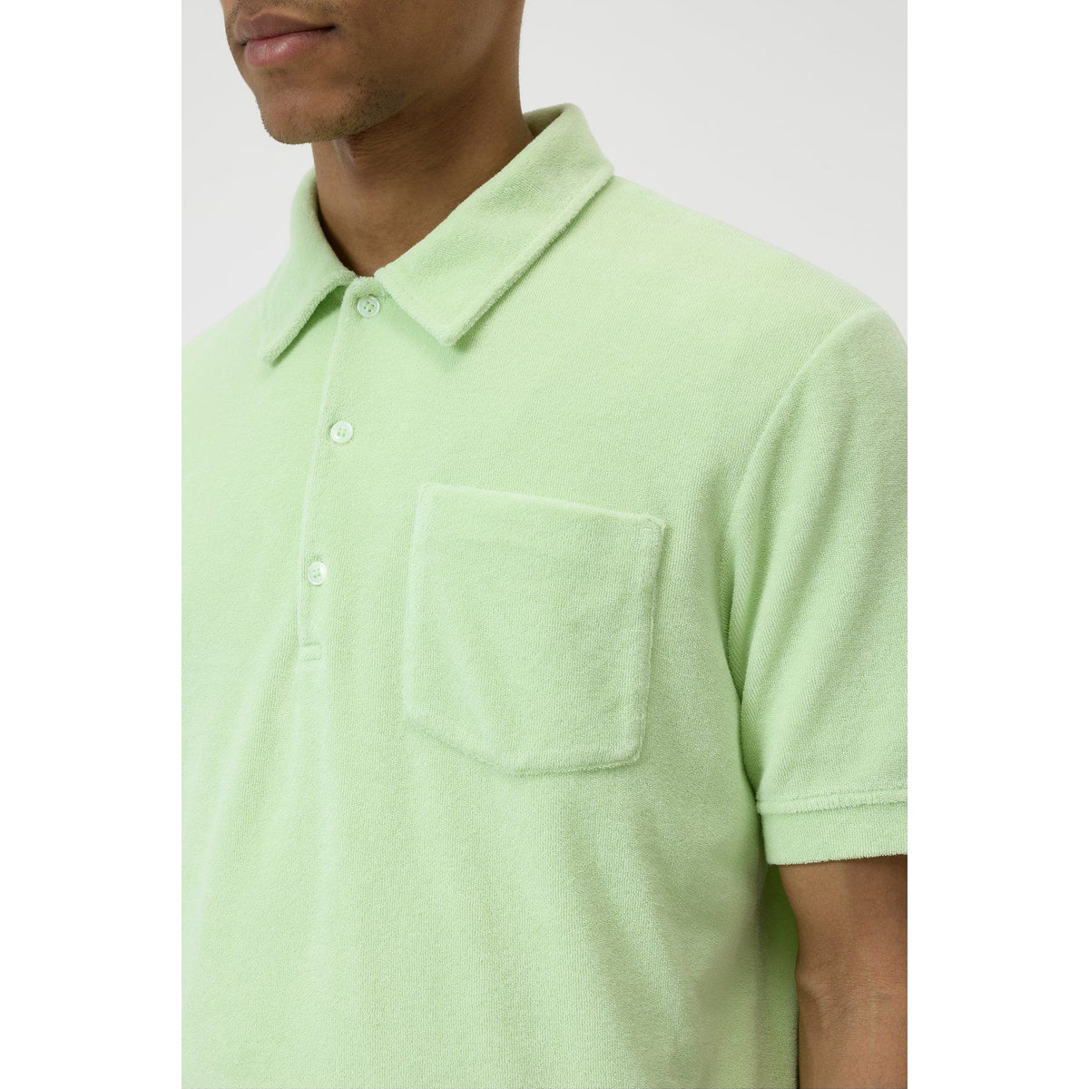 Men's polo collar shirt in Bud Green by Closed Men's, featuring a classic fit with short sleeves and a button-up front.