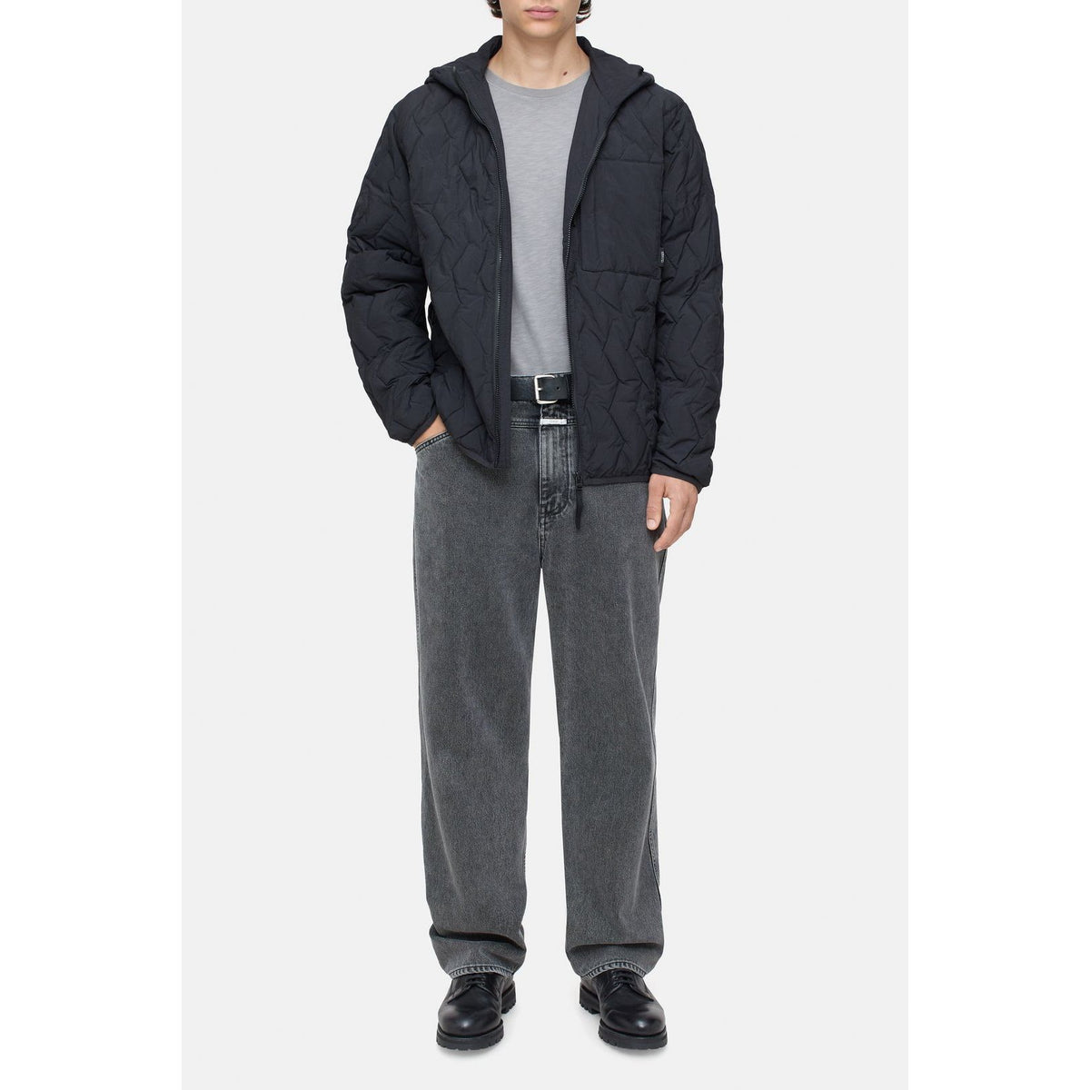 Men's black quilted jacket by Closed Men's, featuring a padded design and front zipper, suitable for cold weather.