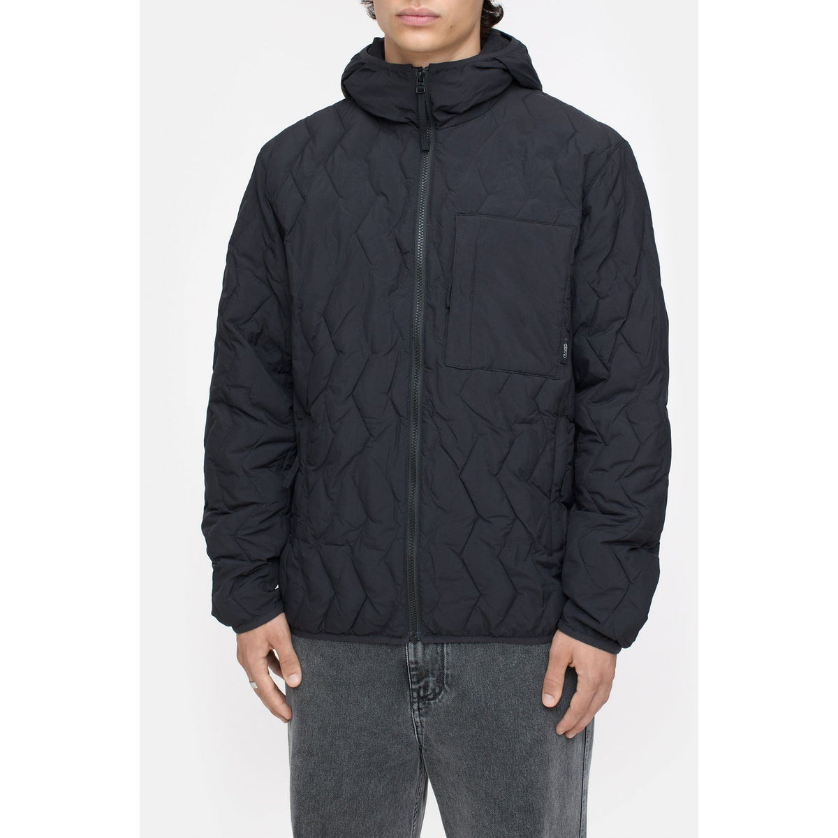 Men's black quilted jacket by Closed Men's, showing front view with padded design and stand collar for warmth and style.