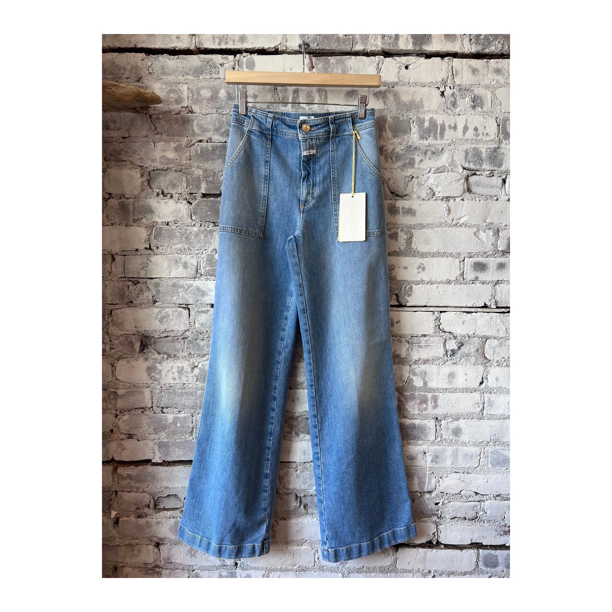 Light blue women's Aria Comfort Stretch Flared Jeans by Closed, featuring a fitted waist and wide-leg design.