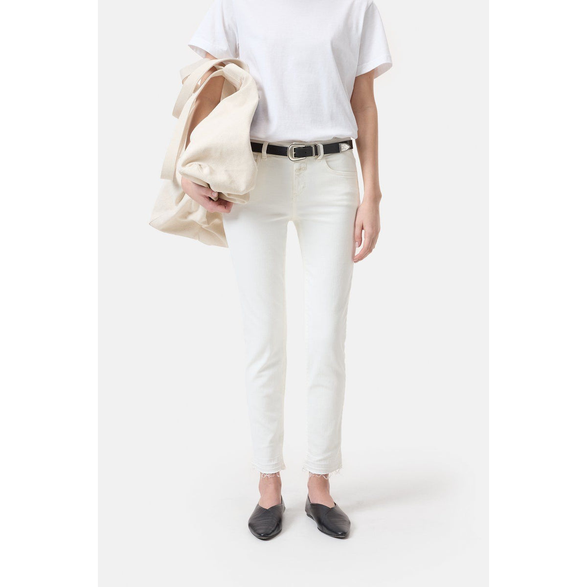 Women's ivory Baker Power Stretch Skinny Jeans by Closed, featuring a close-up of the fitted denim fabric and stylish design.
