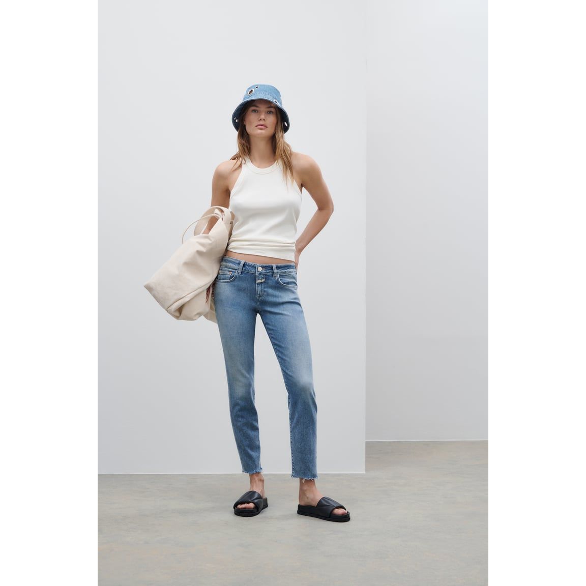 Women's Baker Stretch Skinny Jean in mid blue by Closed, showing the fitted style, lightweight denim, and classic five-pocket design.