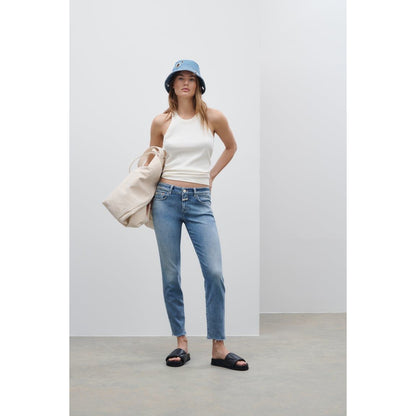 Women's Baker Stretch Skinny Jean in mid blue by Closed, showing the fitted style, lightweight denim, and classic five-pocket design.