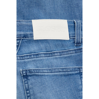 Women's Baker Stretch Skinny Jean in mid blue by Closed, showing the fitted denim style with a classic five-pocket design.