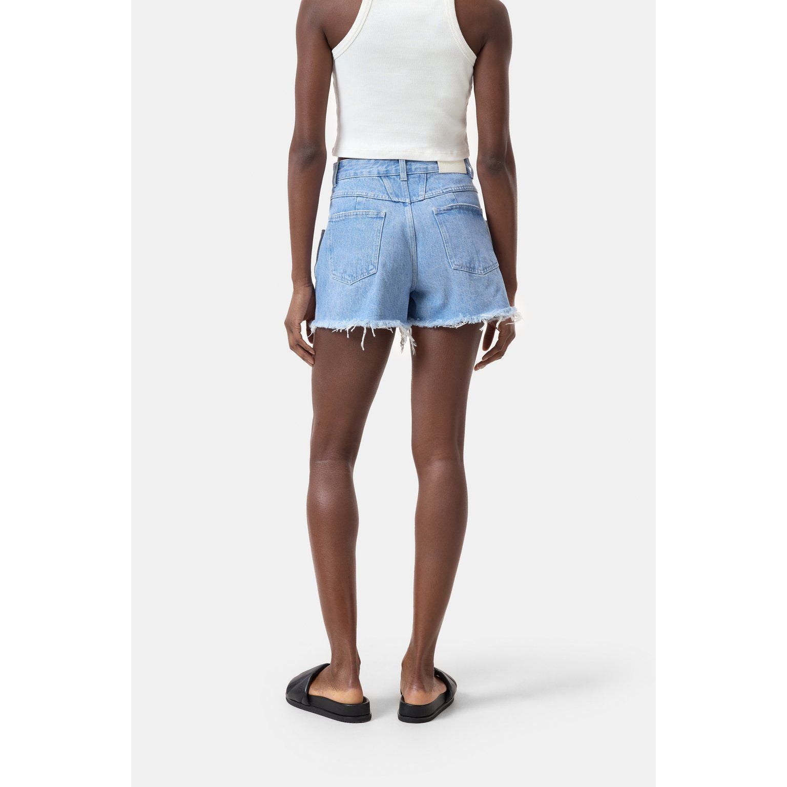 Light blue women's denim shorts by Closed Women's, featuring a classic cut and distressed details, shown on a model.