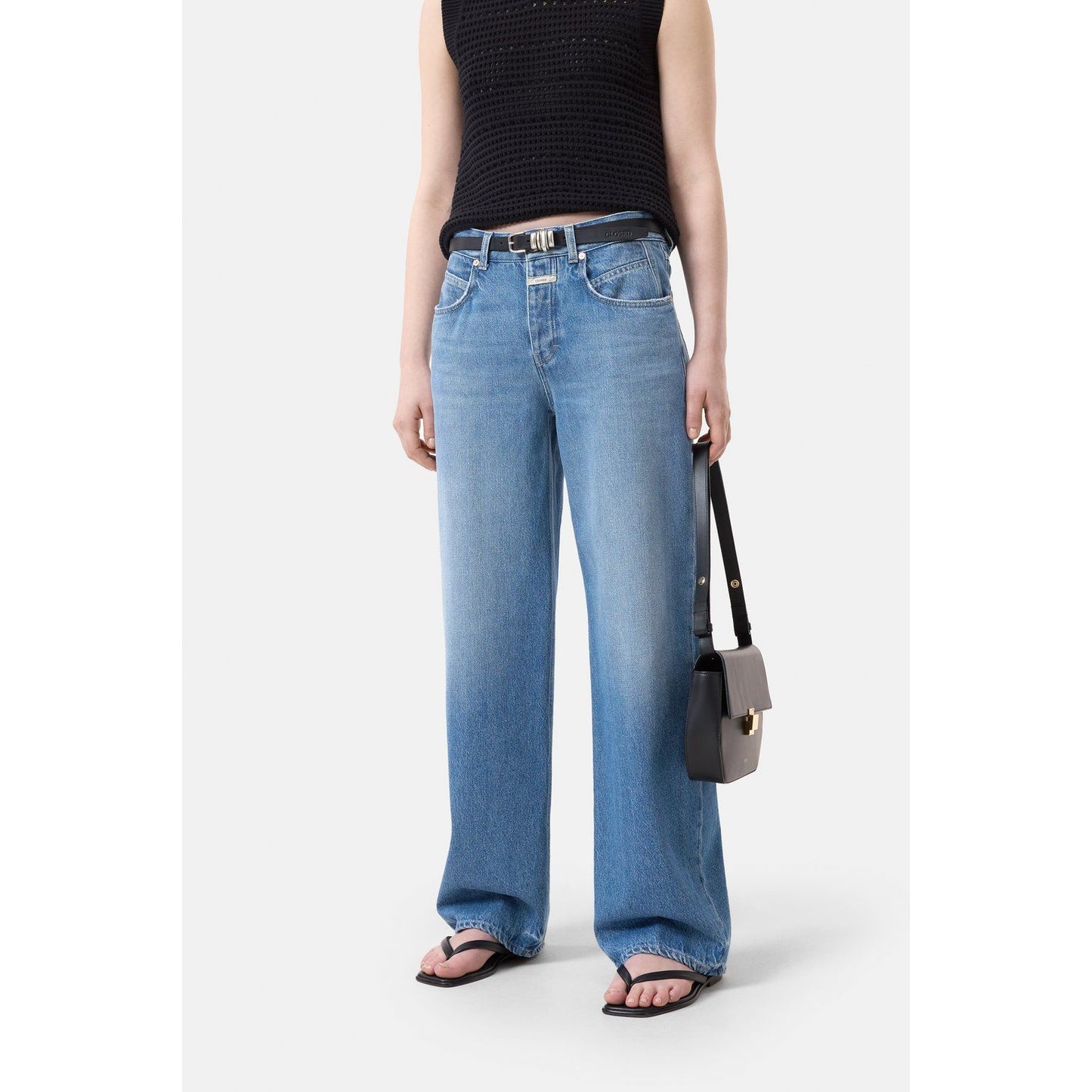 Mid blue women's Nikka Wide Jeans by Closed, showing the relaxed fit and denim texture with a focus on the waistband and pockets.