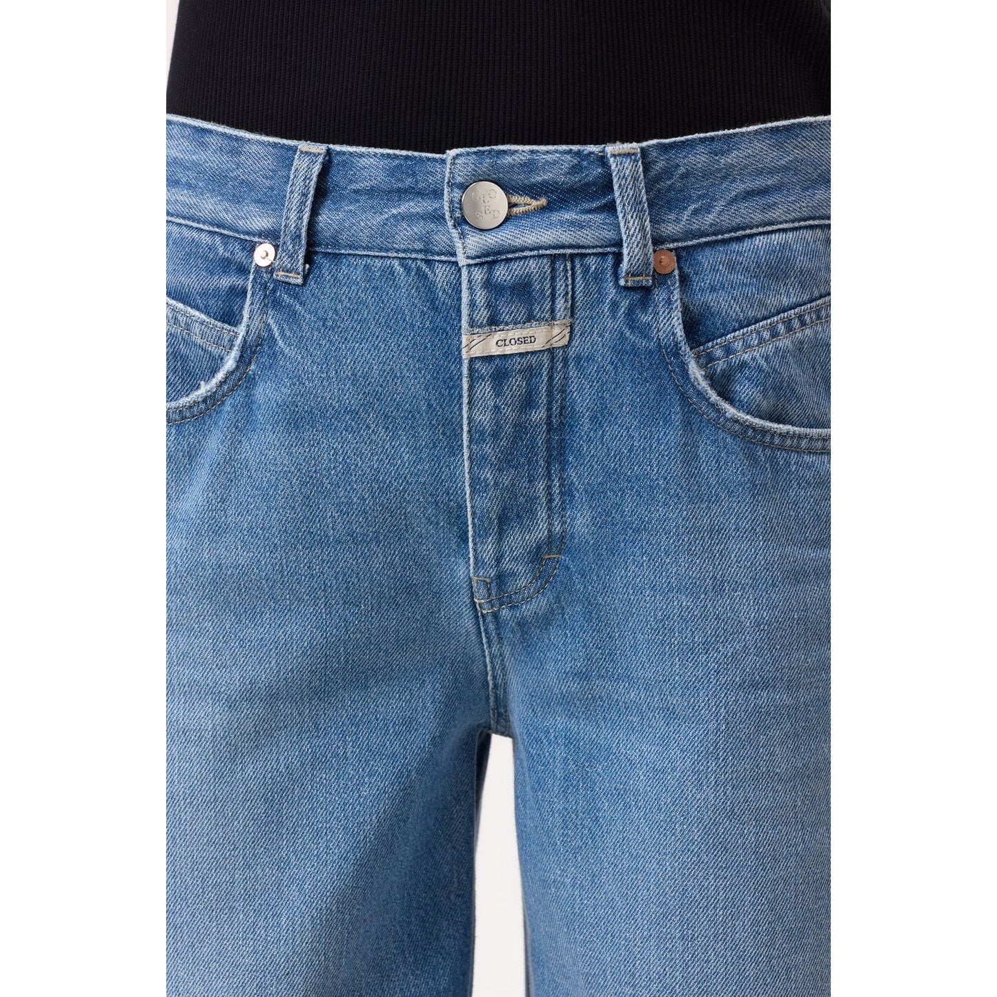 Women's Nikka Wide Jeans in mid blue by Closed, shown on a model, featuring a relaxed fit and classic denim style.