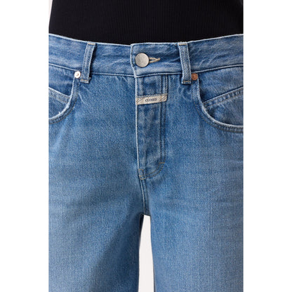 Women's Nikka Wide Jeans in mid blue by Closed, shown on a model, featuring a relaxed fit and classic denim style.