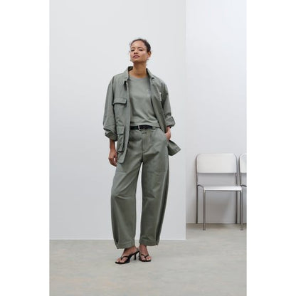 Women's Rhannon Barrel Pants in faded green by Closed, showcasing relaxed fit and stylish design on a model.