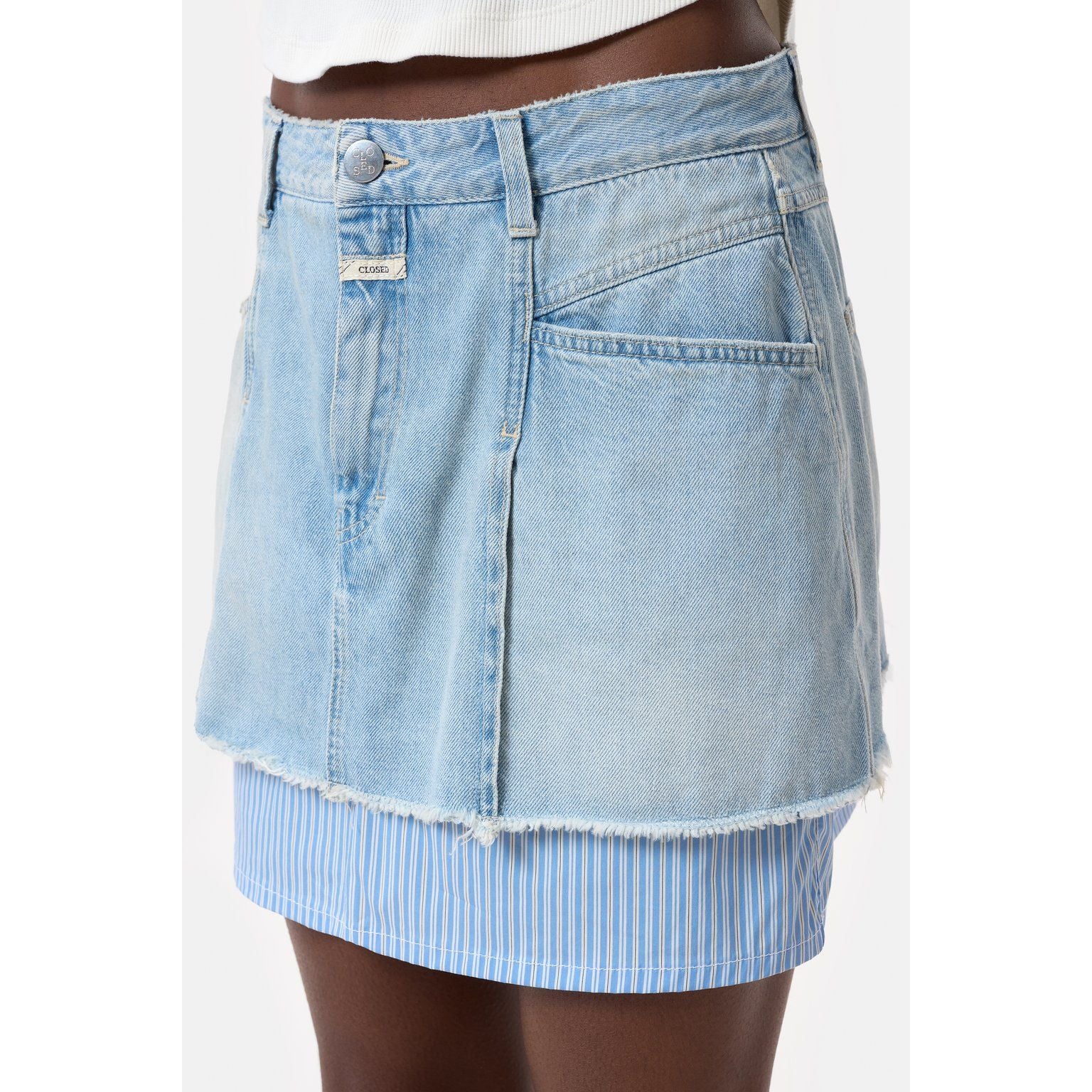 Light blue women's short denim poplin mini skirt by Closed Women's, shown on a hanger against a plain background.