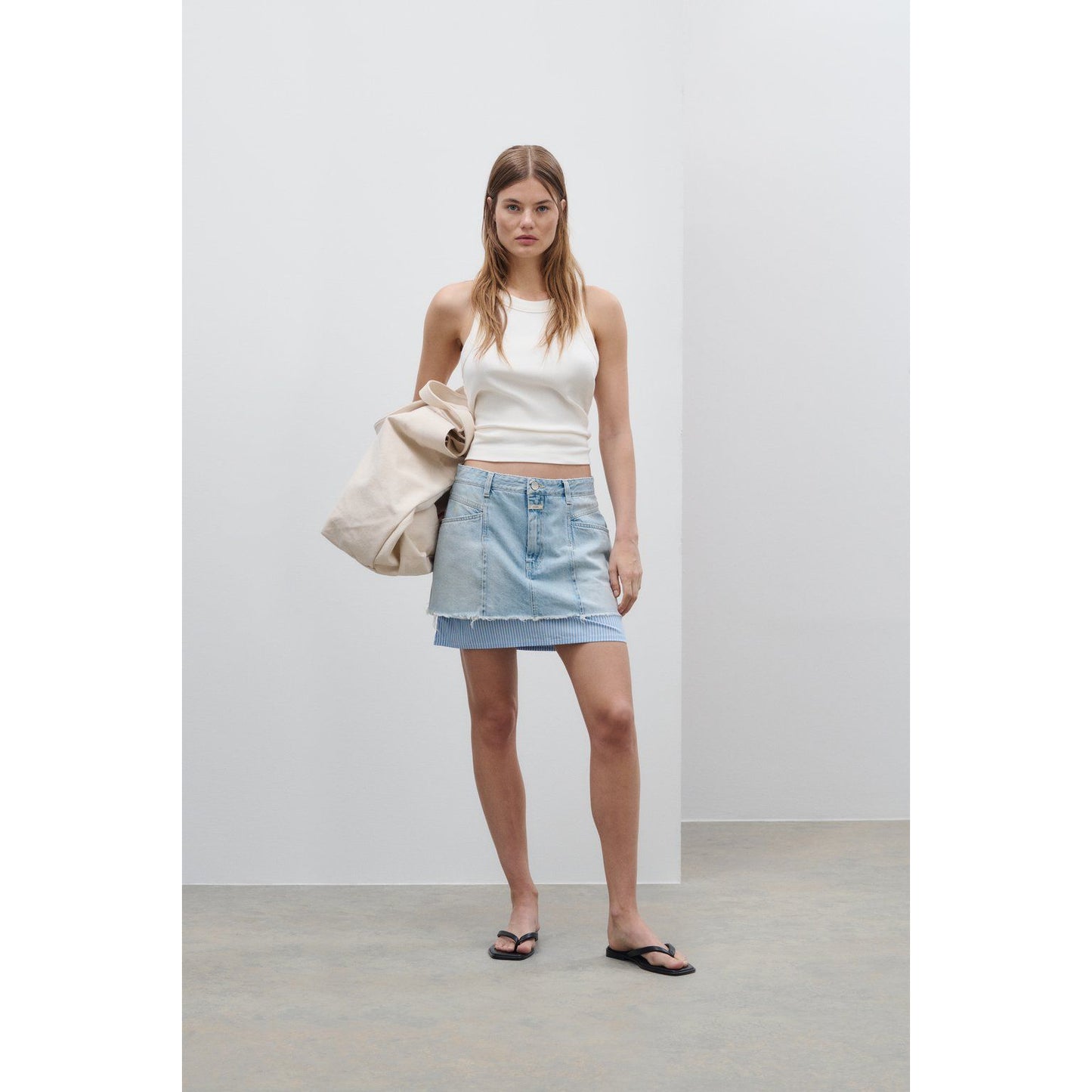Light blue women's short denim poplin mini skirt by Closed Women's, showing the fitted waistband and casual style.