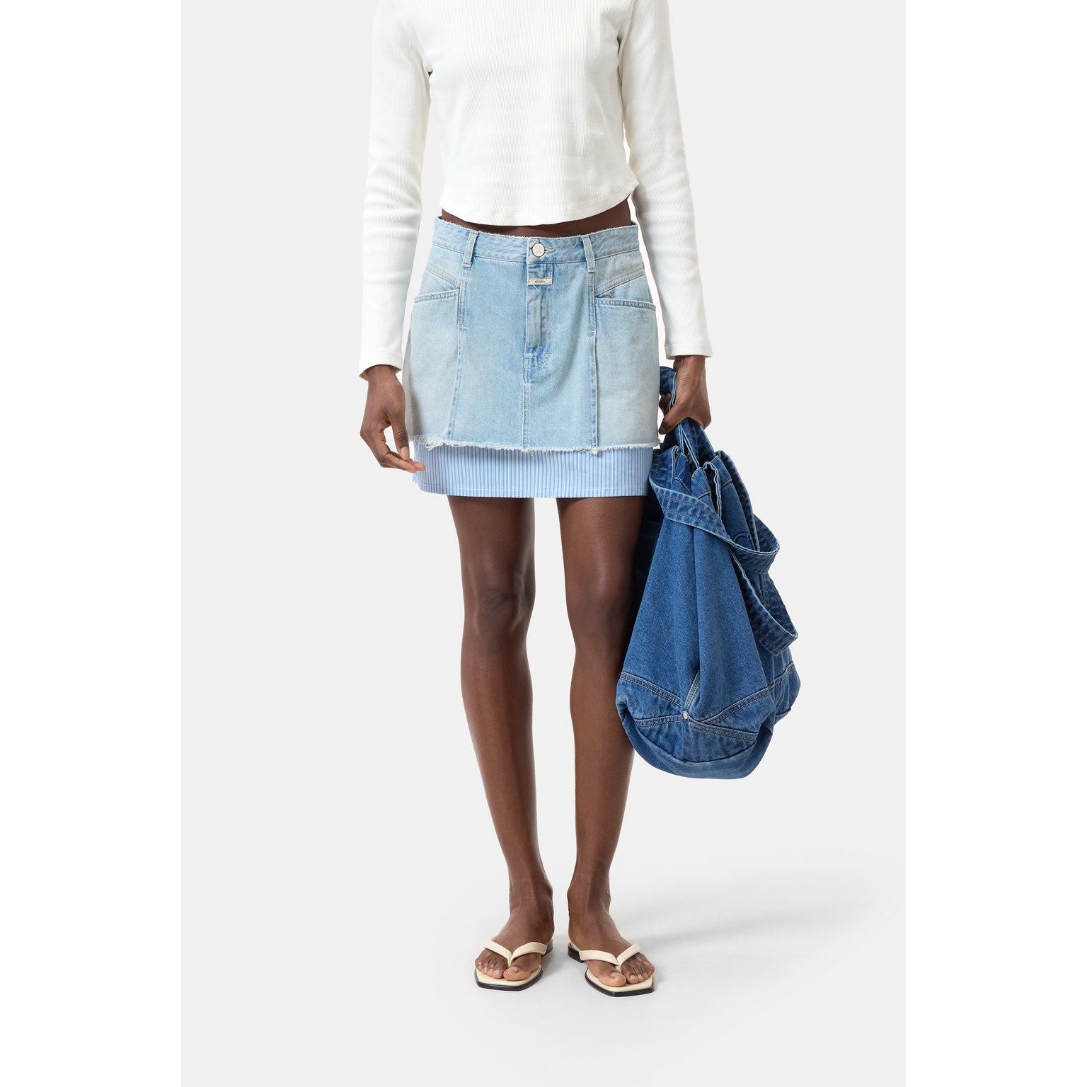 Light blue women's short denim poplin mini skirt by Closed Women's, featuring a stylish, fitted design with front pockets.