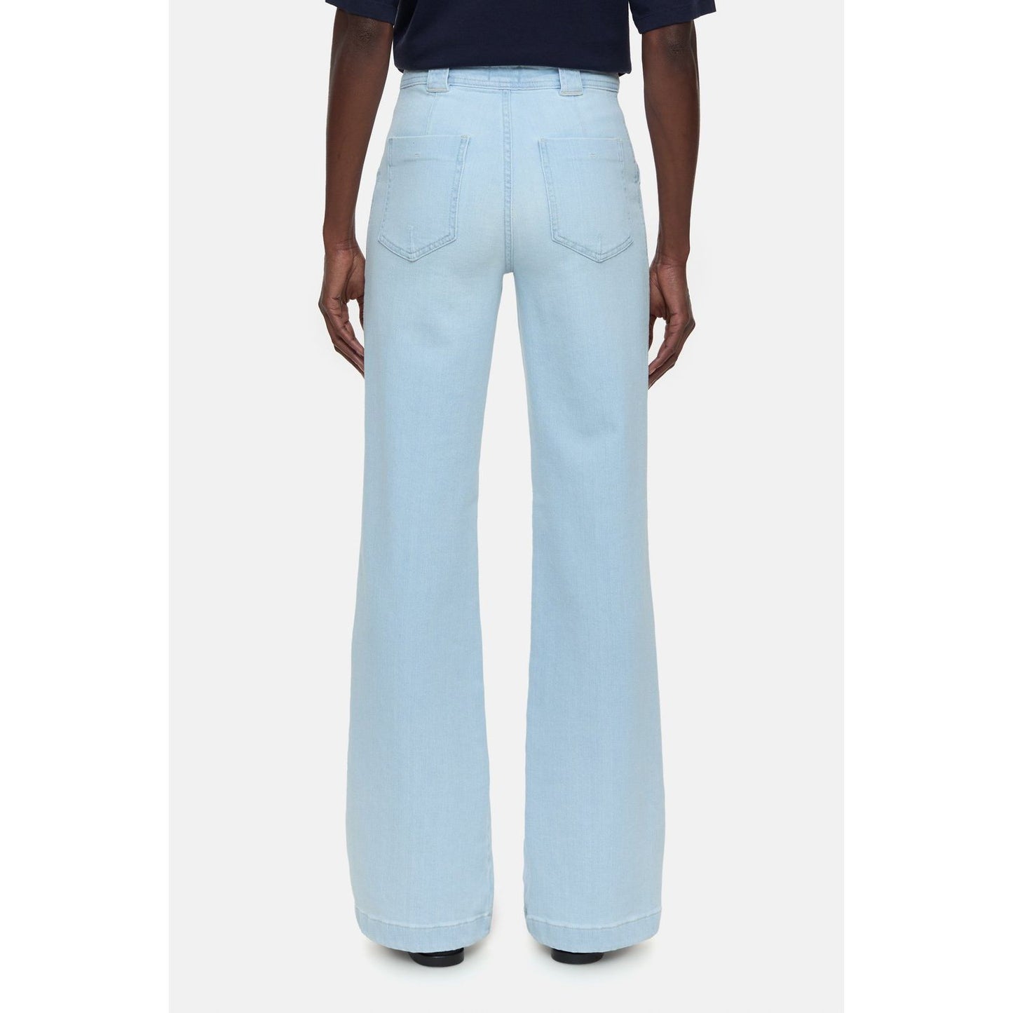 Light blue women's Aria Slim Jeans by Closed Women's, showing fit and denim fabric in a natural pose.