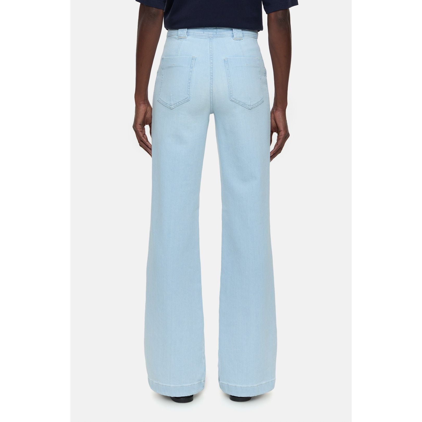 Light blue women's Aria Slim Jeans by Closed Women's, showing fit and denim fabric in a natural pose.
