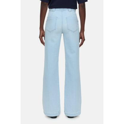 Light blue women's Aria Slim Jeans by Closed Women's, showing fit and denim fabric in a natural pose.