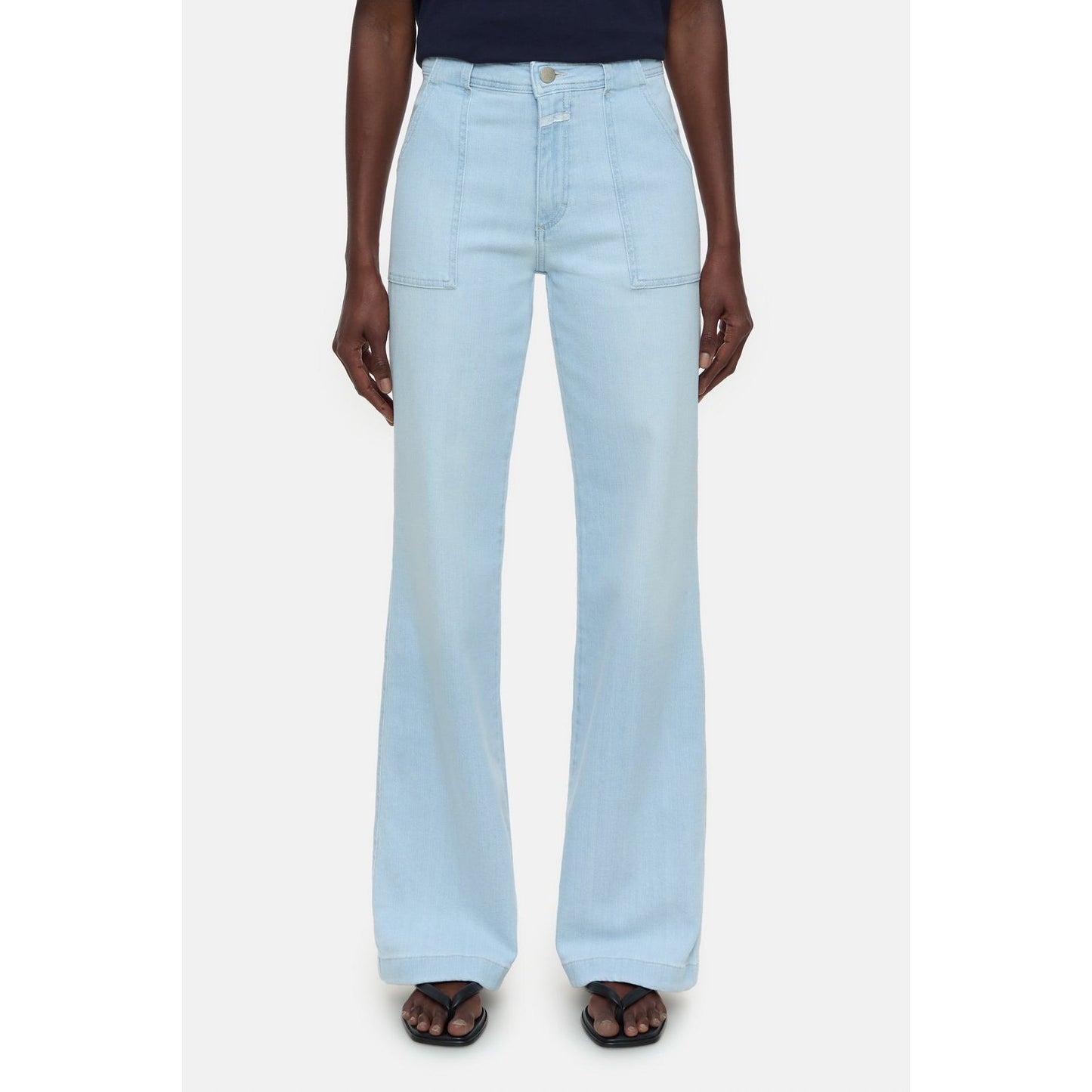 Light blue Closed Women's Aria Slim Jeans for women, showing the fitted style and classic denim texture.