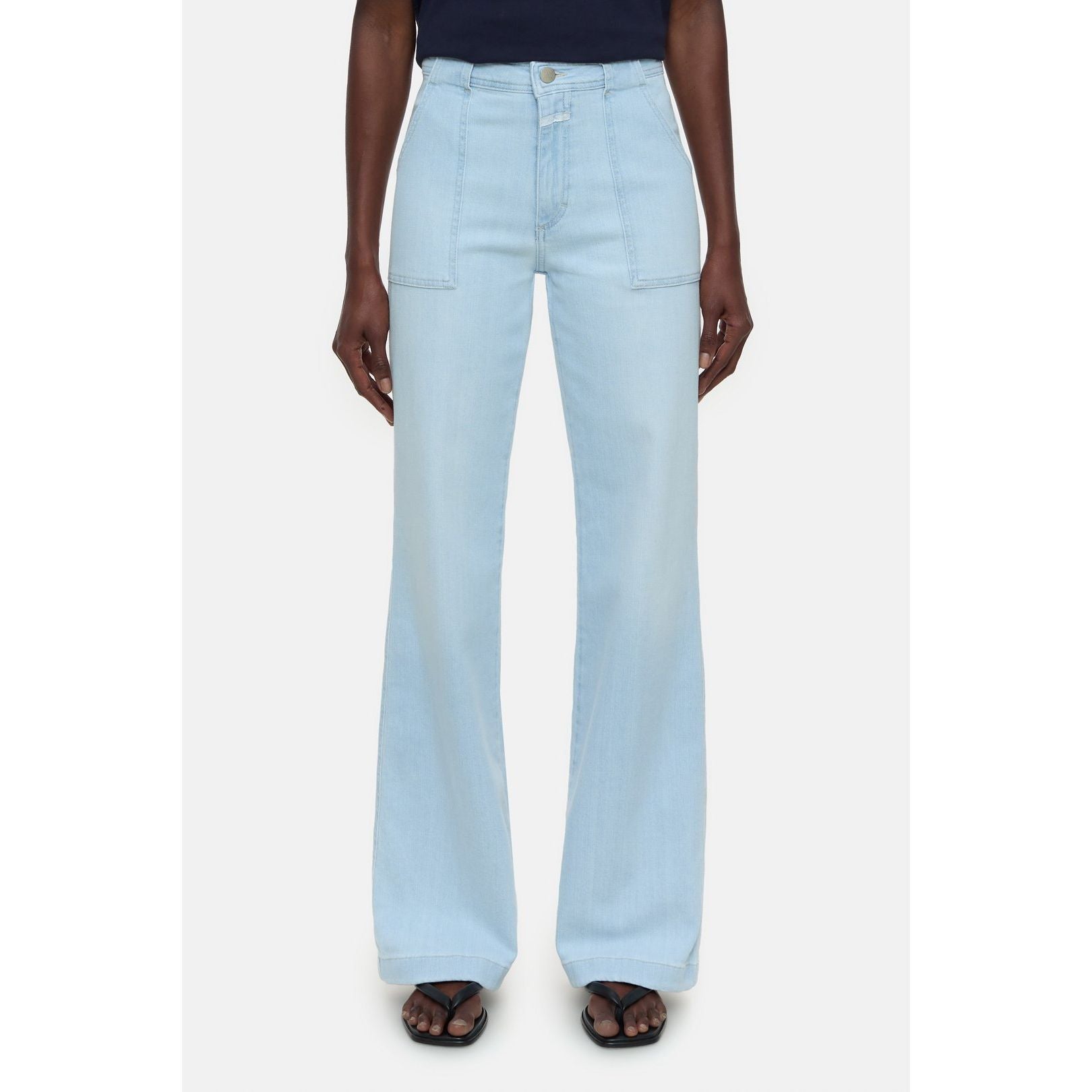 Light blue Closed Women's Aria Slim Jeans for women, showing the fitted style and classic denim texture.
