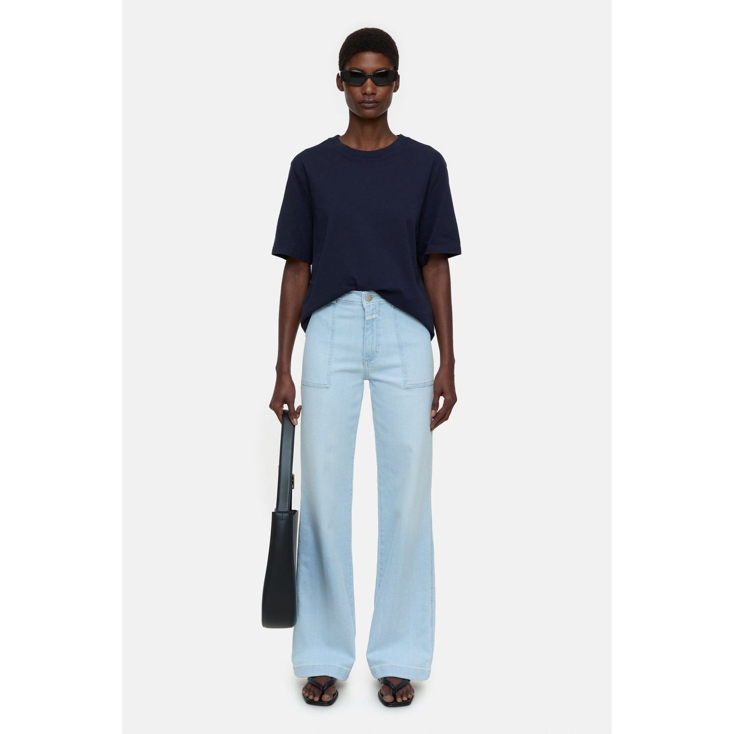 Light blue women's Aria Slim Jeans by Closed Women's, showing fit and denim fabric detail.