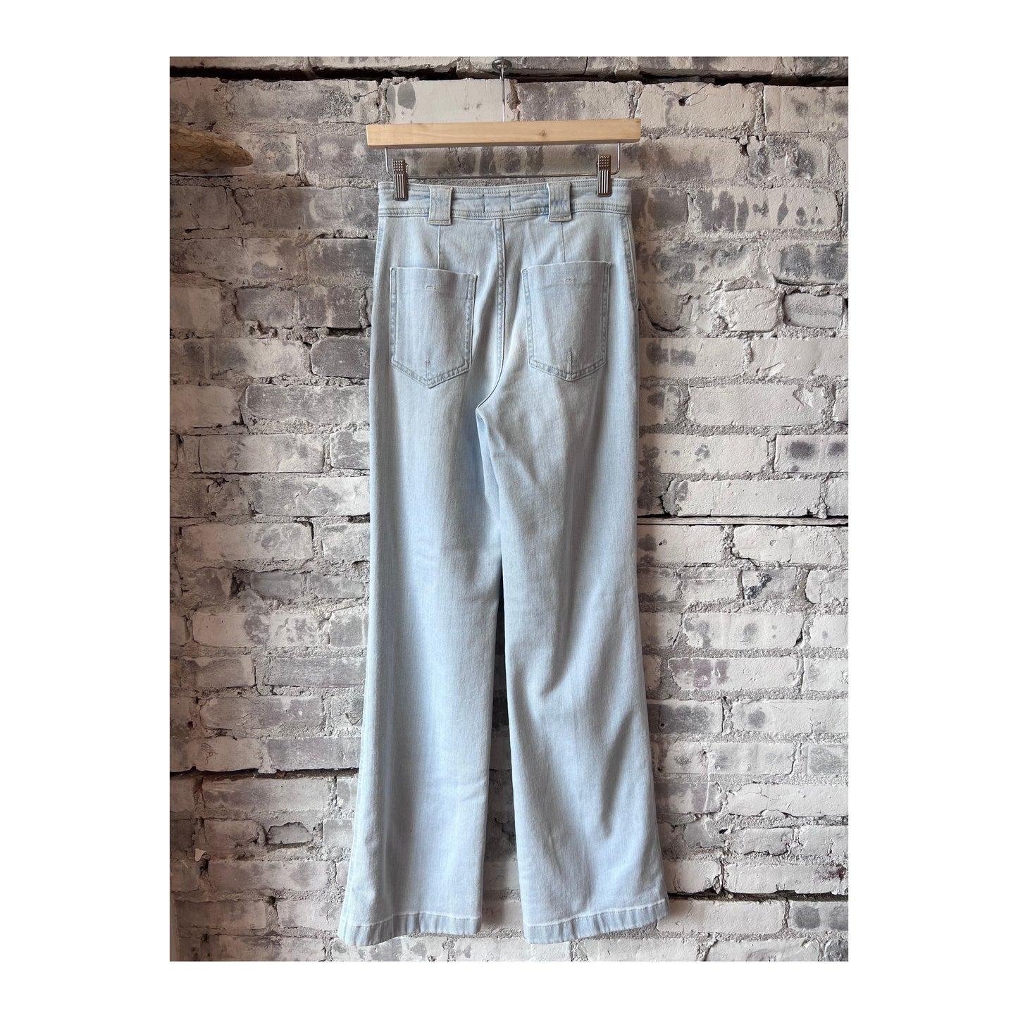 Light blue women's Aria Slim Jeans by Closed Women's, showing the fitted denim style with front pockets and belt loops.