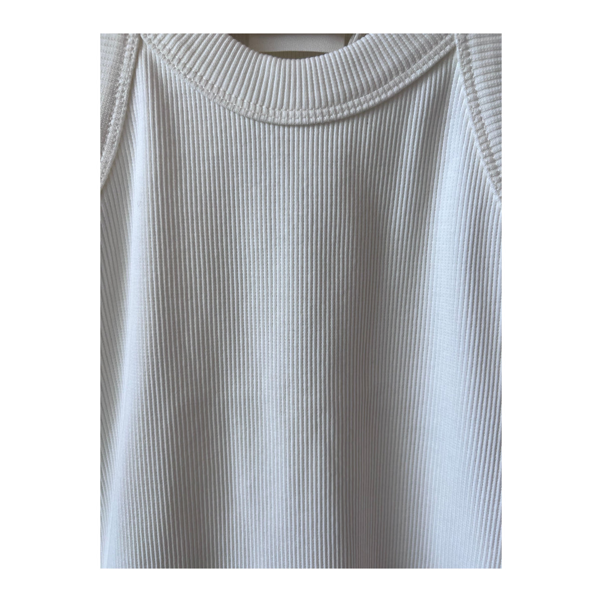 Ivory women's cropped racer top by Closed Women's, shown on a model with a fitted style and sleeveless design.