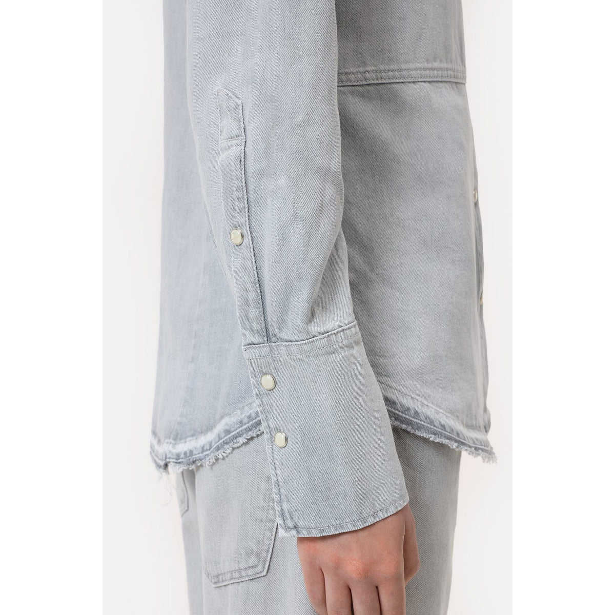 Light grey women's denim shirt by Closed Women's, showing a casual button-up with collar and long sleeves.