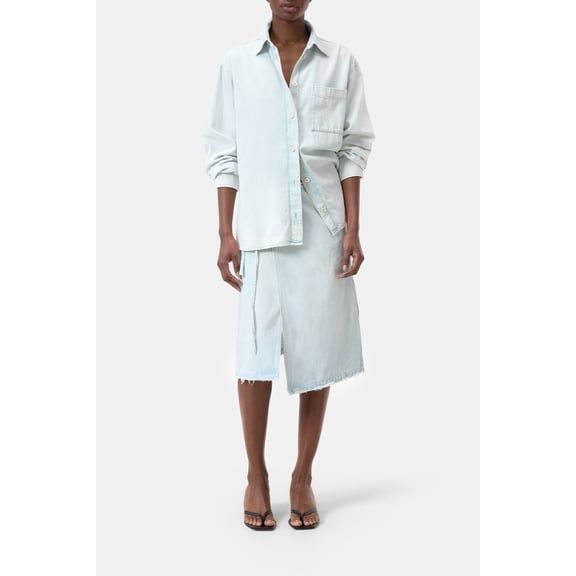 Women's washed out blue denim shirt by Closed Women's, displayed hanging with button details and classic collar.