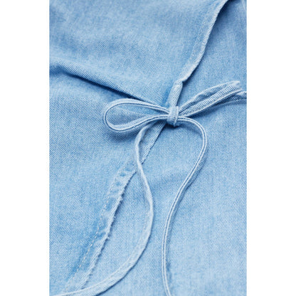Light blue women's denim wrap top by Closed, shown on a model, featuring long sleeves and a fitted waist.