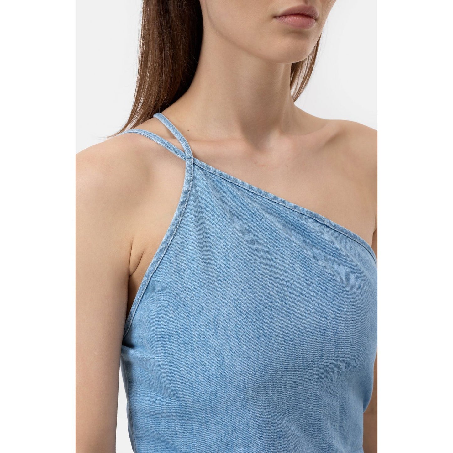 Light blue women's denim wrap top by Closed, showcasing the fitted design and stylish wrap front detail.