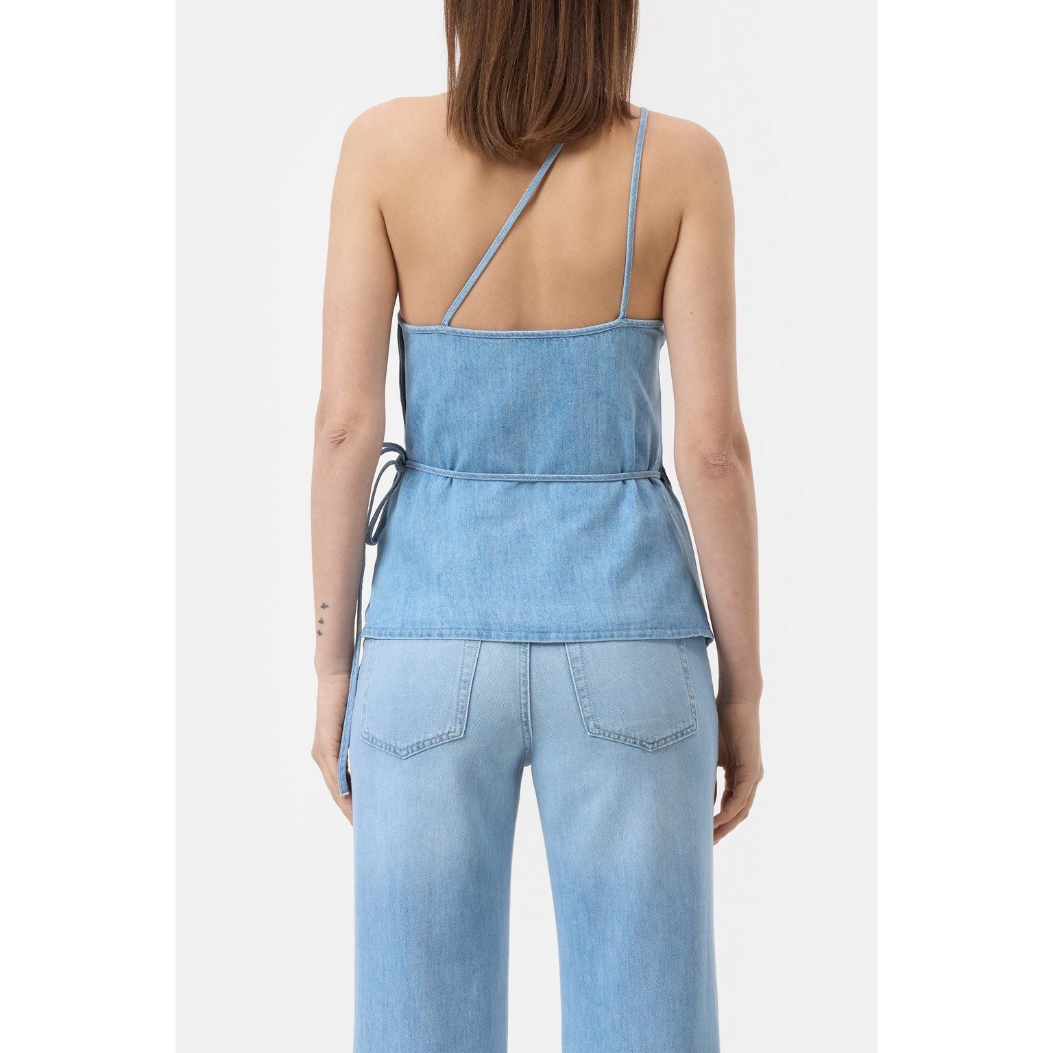 Light blue women's denim wrap top by Closed Women's, showing the fitted design and front tie detail.