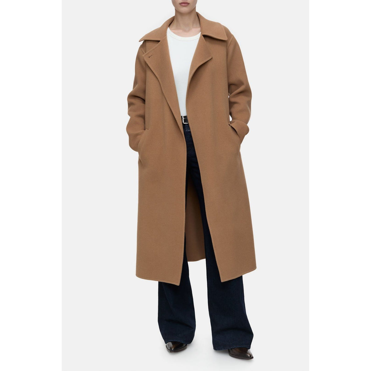 Women's DoubleFace Coat in Biscotti Brown by Closed, shown hanging on a wooden rack with a cozy, reversible design.
