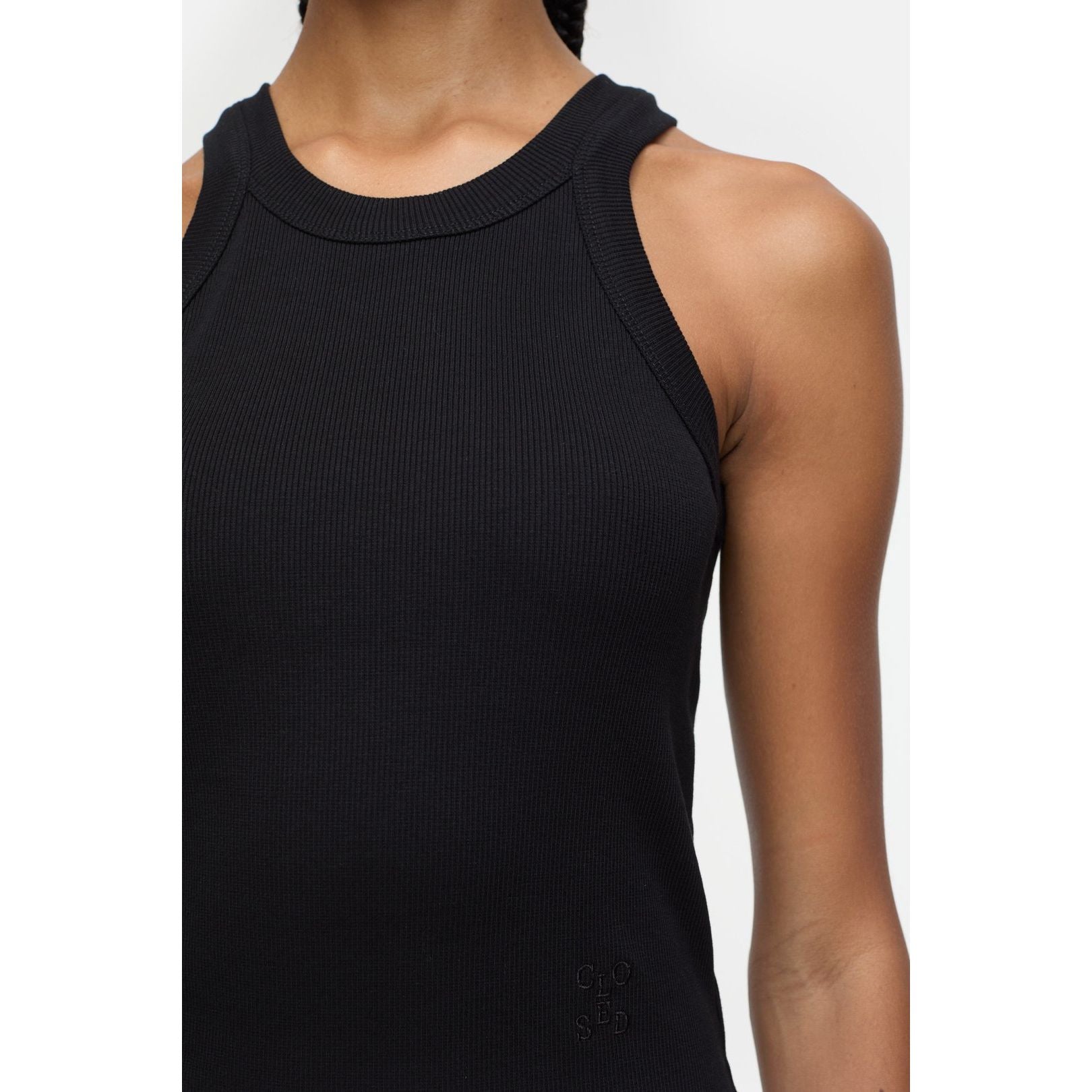 Black women's Racer Top by Closed Women's, close-up view showing fitted fabric and sleek design.