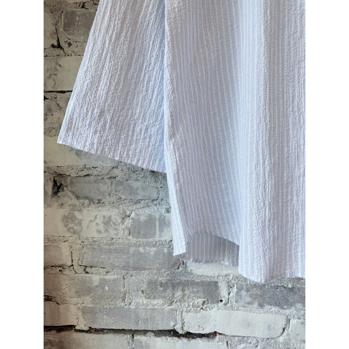 White and light blue woven women's shirt from Hartford Women's with a classic collar and button-front design.