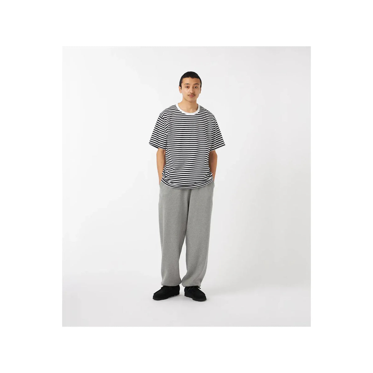 Men's black and navy COOLMAX stripe jersey tee by nanamica, featuring a comfortable, lightweight fabric and stylish striped design.