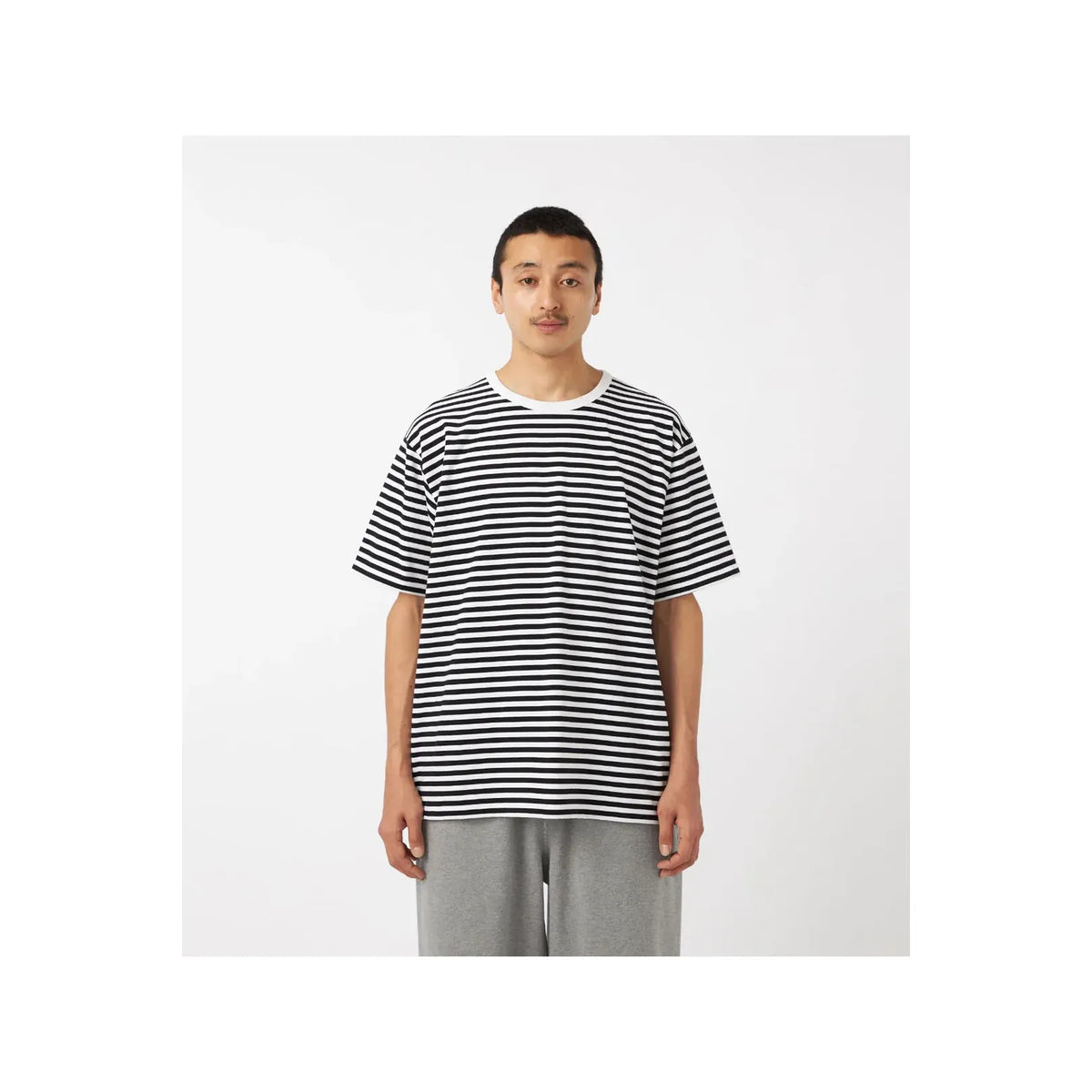 Men's black and navy striped COOLMAX jersey tee by nanamica, featuring a casual fit and soft, breathable fabric.