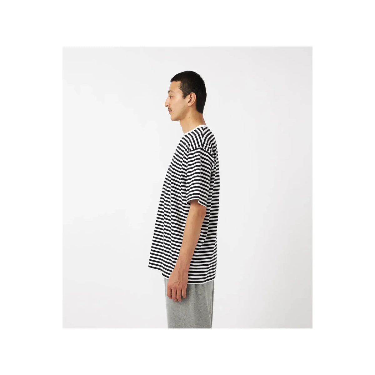 Men's black and navy COOLMAX Stripe Jersey T-shirt by nanamica, featuring a comfortable, lightweight striped knit fabric.
