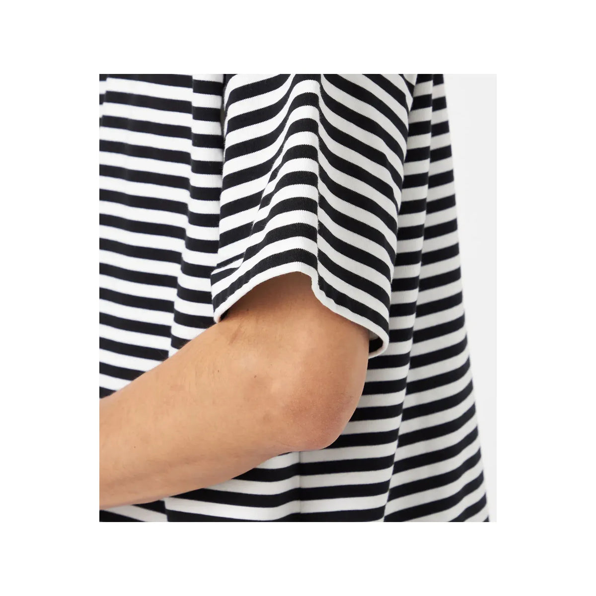 Men's black and navy COOLMAX Stripe Jersey Tee by nanamica, showing the lightweight, breathable fabric with horizontal stripe pattern.