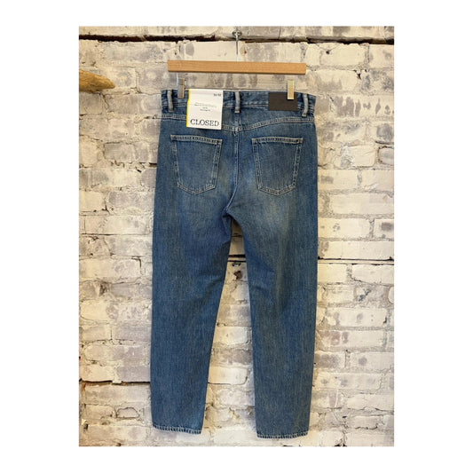 Men's Cooper True Regular Jean in mid blue denim from Closed Men's, showing classic fit and sturdy fabric.