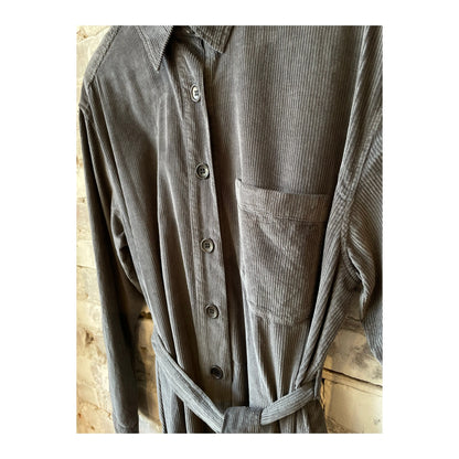 Charcoal Hartford Women's Corduroy Revol Dress displayed on a hanger, showing its textured fabric and classic style.