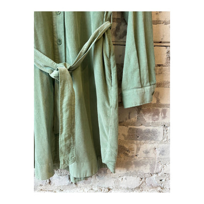 Hartford Women's jade corduroy Revol dress, front view showing fitted silhouette and textured fabric.