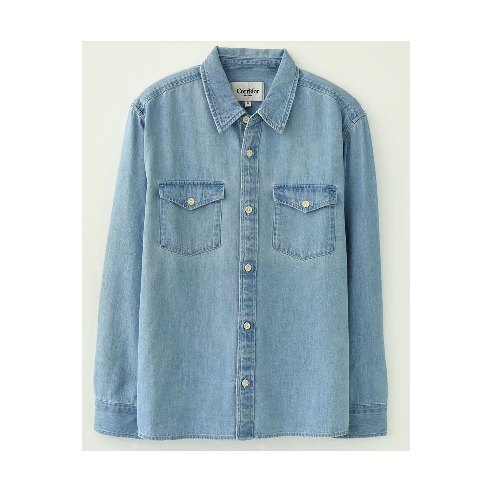 Light indigo men's denim shirt by Corridor, long-sleeve casual shirt with classic denim styling, displayed on a hanger.