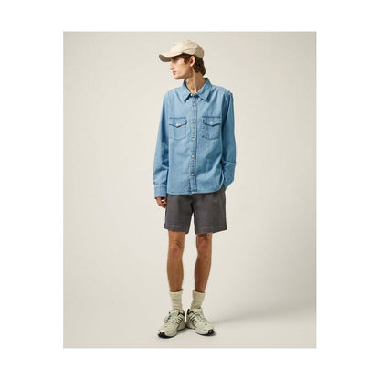 Men's light indigo denim shirt by Corridor, long-sleeve casual shirt with button front and classic denim texture.