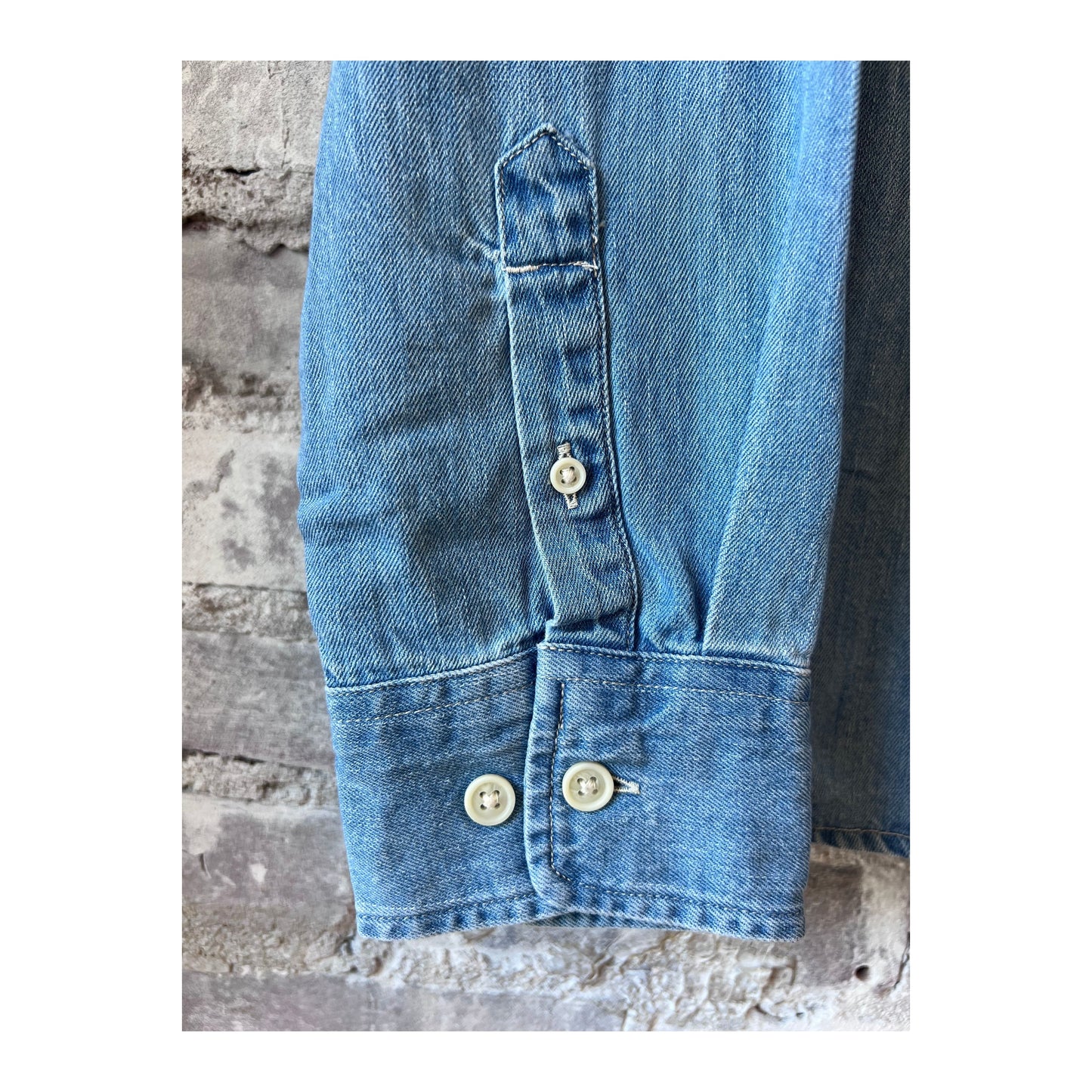 Light indigo men's denim shirt by Corridor, long-sleeve casual shirt with button-down front and classic denim texture.