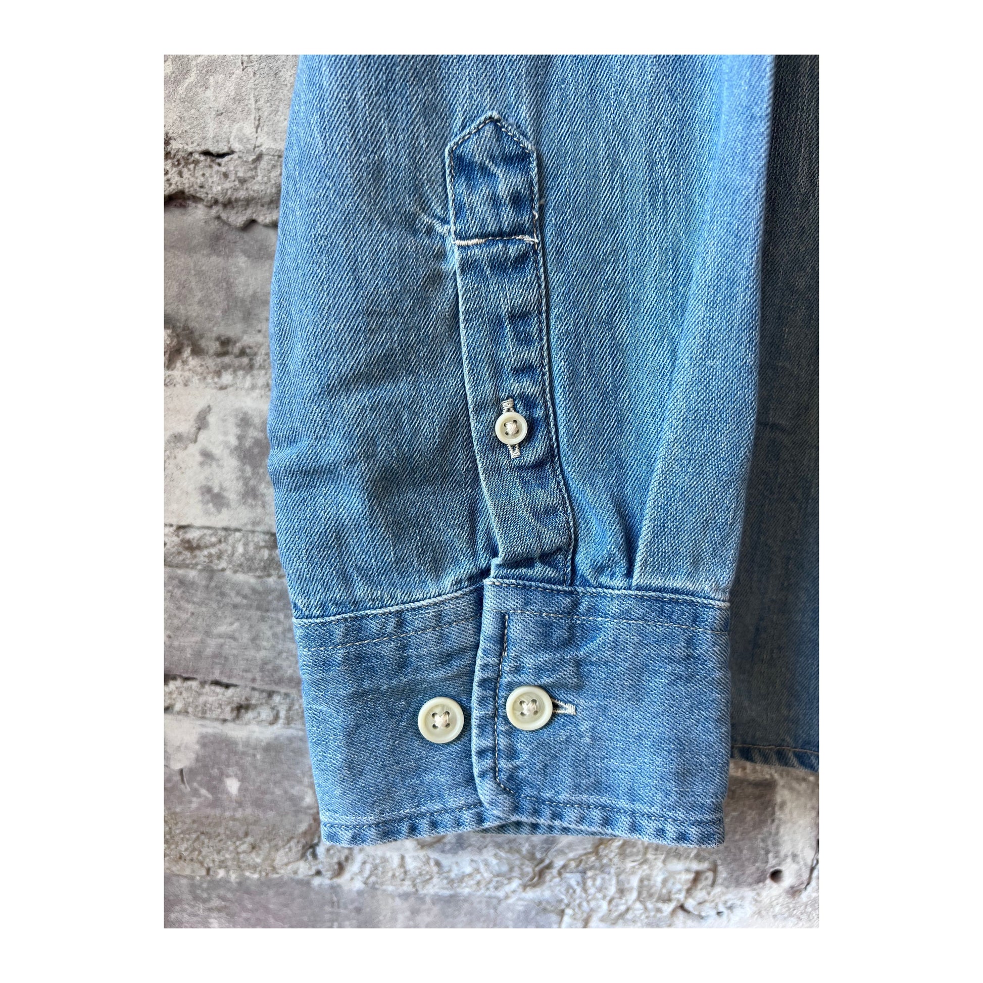 Light indigo men's denim shirt by Corridor, long-sleeve casual shirt with button-down front and classic denim texture.